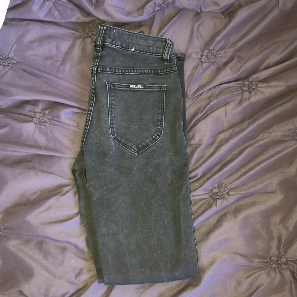 High waisted black jeans with rips in the knees